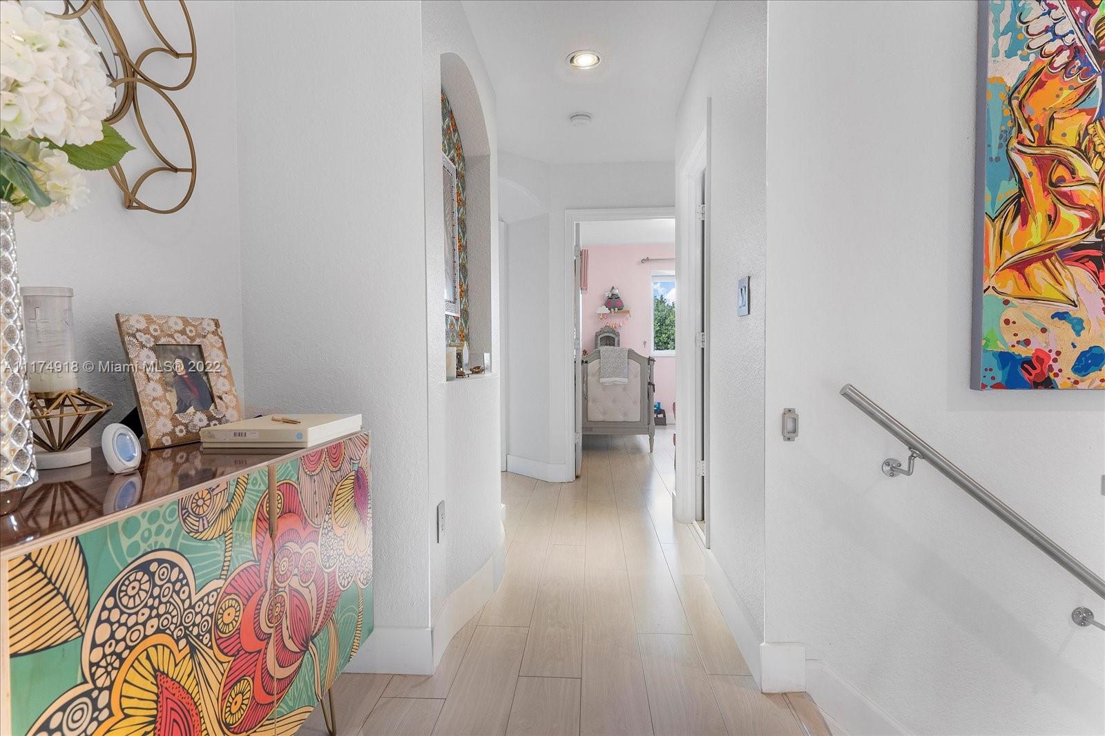 Doral Isles Doral, FL 33178 - Photo 24 of 38 a view of entryway with wooden floor