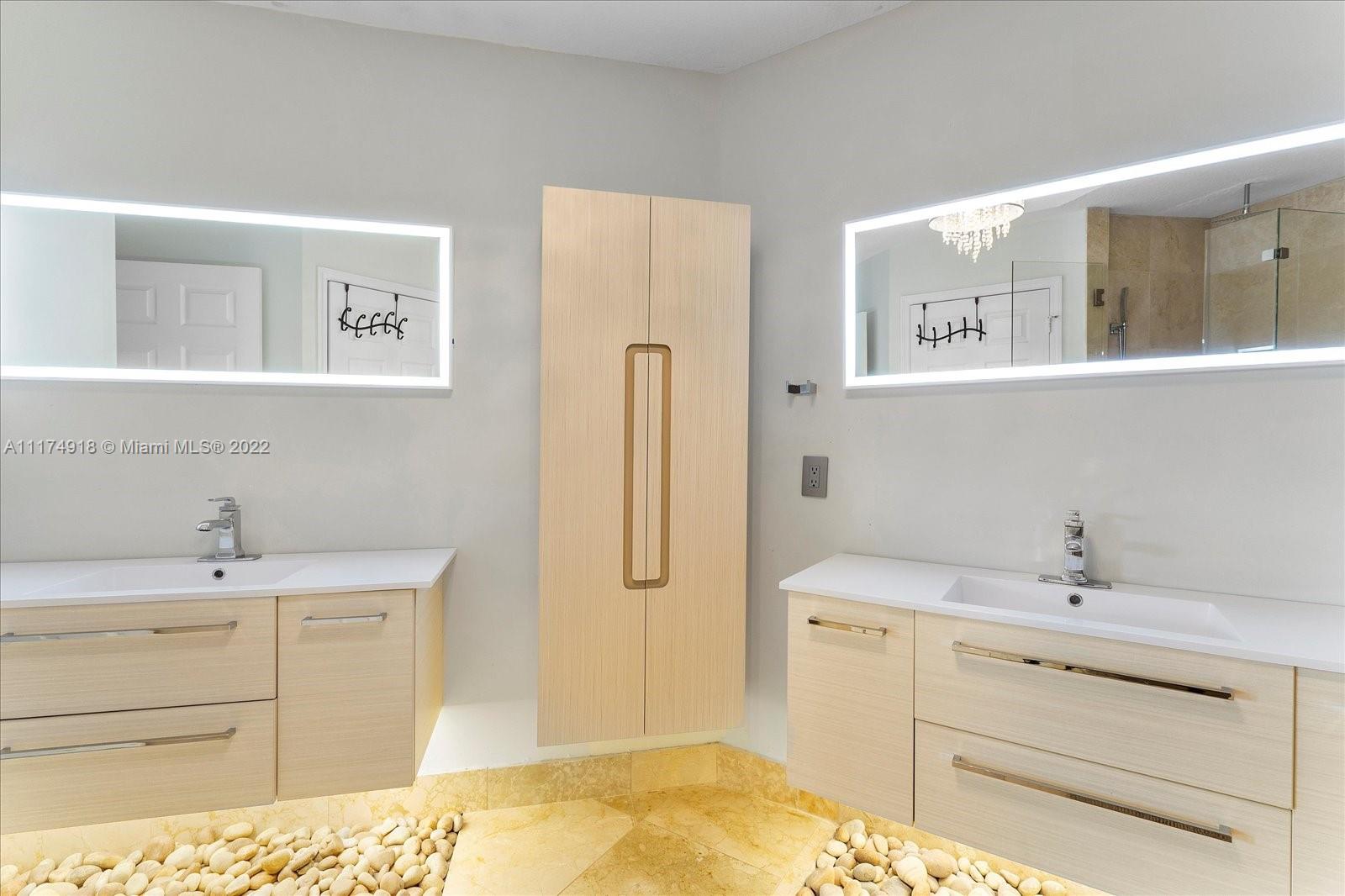 Doral Isles Doral, FL 33178 - Photo 30 of 38 a bathroom with a sink double vanity and a mirror