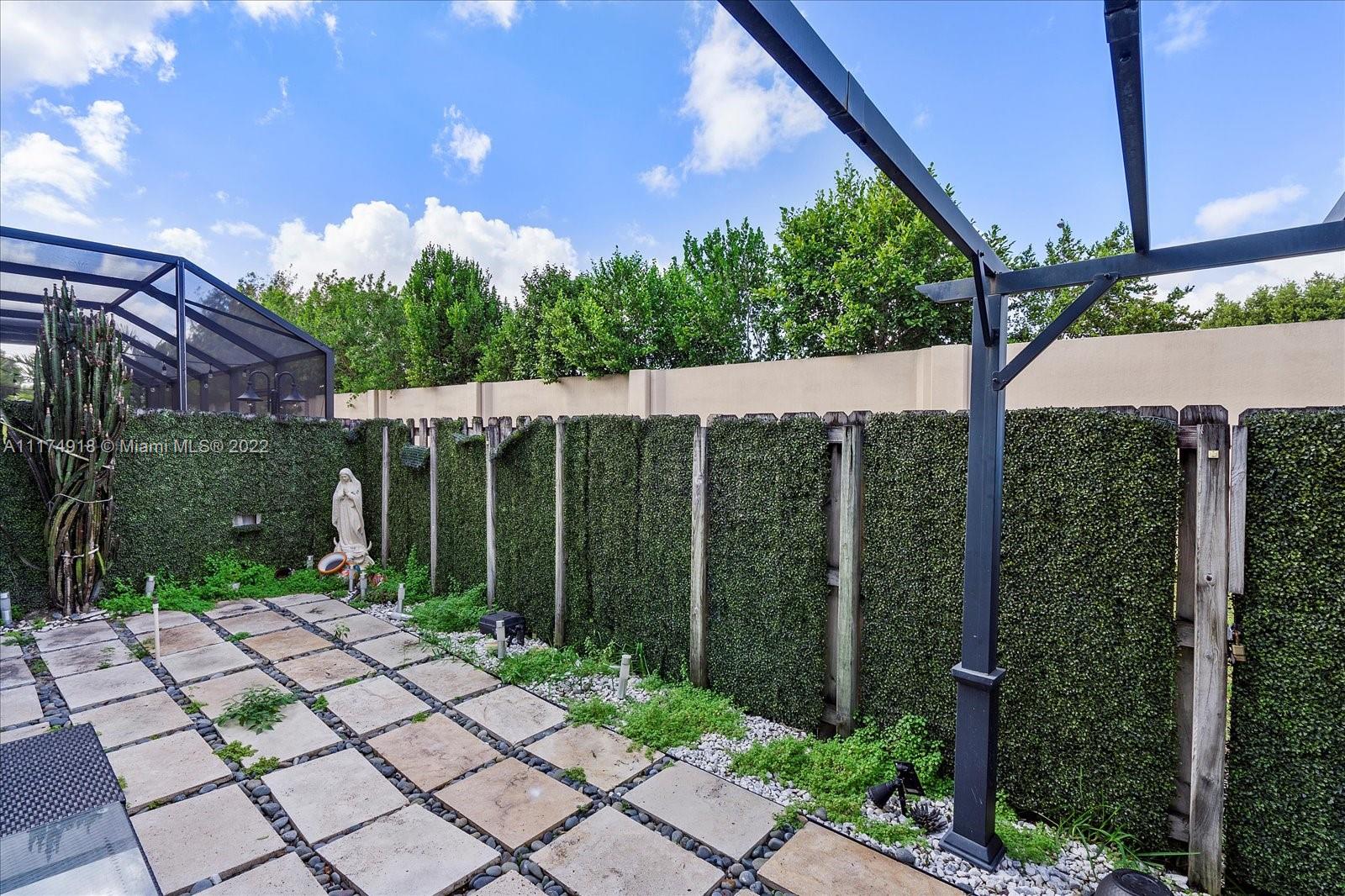 Doral Isles Doral, FL 33178 - Photo 32 of 38 a backyard of a house with lots of green space