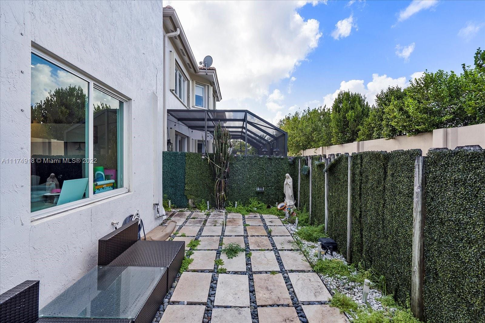 Doral Isles Doral, FL 33178 - Photo 33 of 38 a view of backyard with a patio
