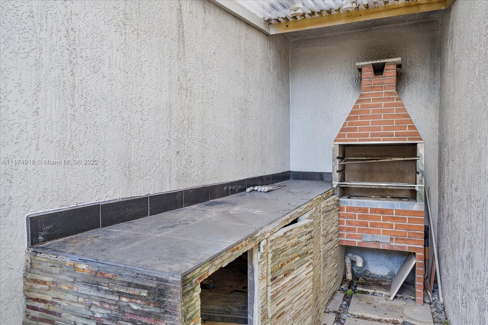 Doral Isles Doral, FL 33178 - Photo 36 of 38 a bedroom with a bed and a window