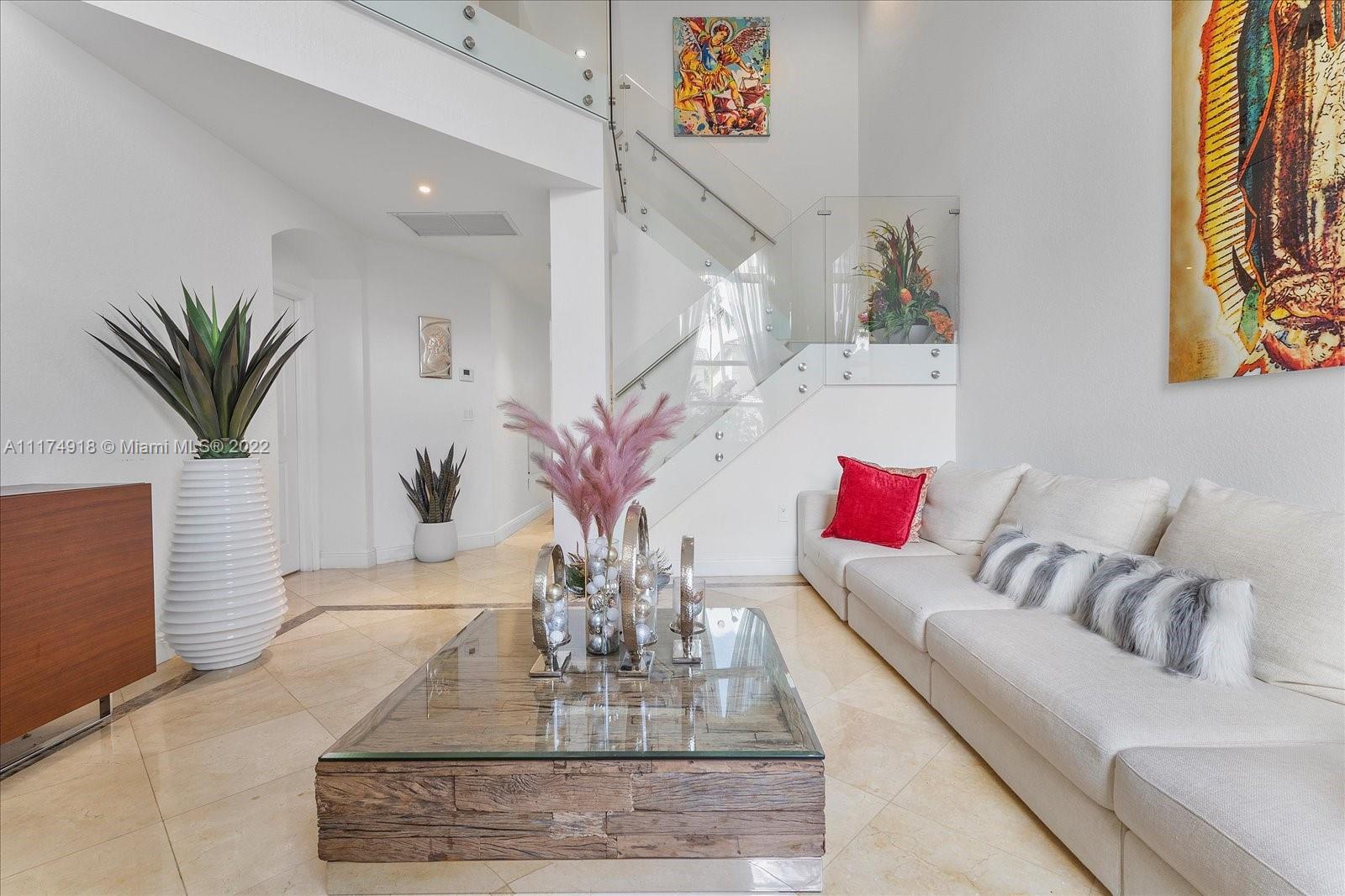 Doral Isles Doral, FL 33178 - Photo 9 of 38 a living room with furniture and wooden floor