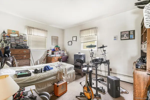 a room with furniture a rug and a window