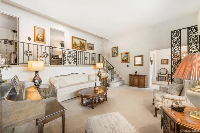 a bedroom with furniture and a book shelf