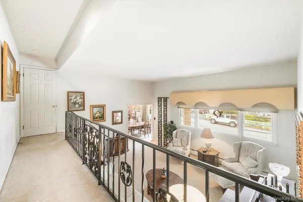 a view of a chairs and table in a balcony