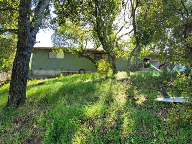 a view of backyard of a house