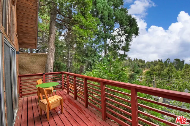 a view of a house with a tree