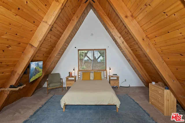 a view of living room kitchen with furniture and wooden floor