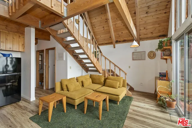 a balcony with table and chairs