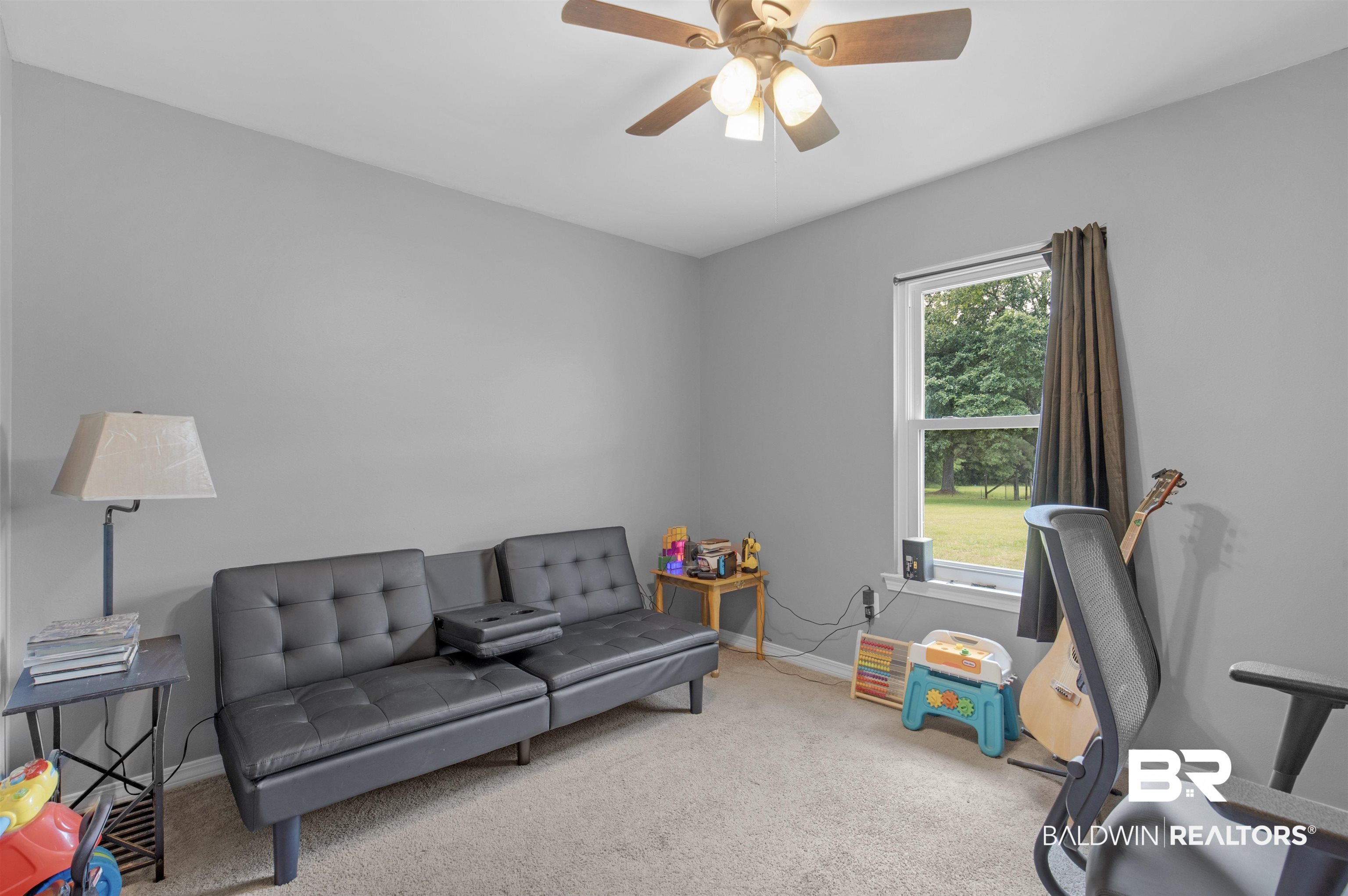 13925 Fort Lake Road Grand Bay, AL 36541 - Photo 18 of 37 Carpeted office with a ceiling fan and baseboards