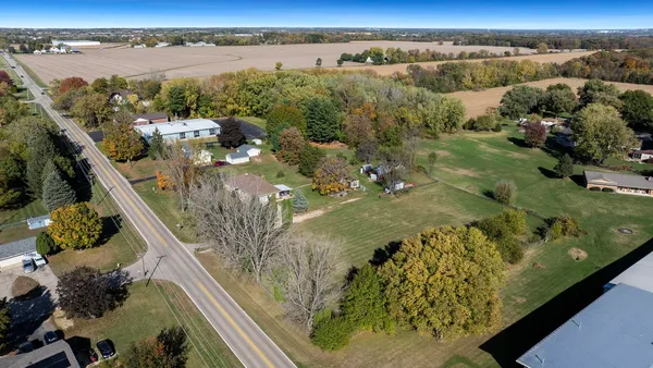 a view of a dining room with furniture and a chandelier