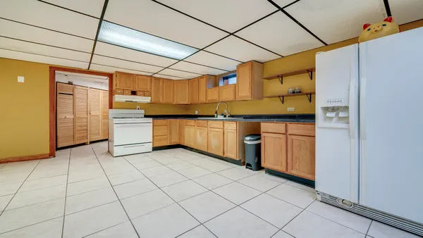 a view of a patio with table and chairs