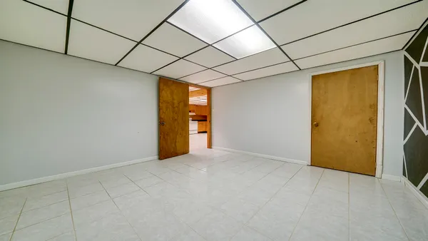 an aerial view of residential houses with outdoor space