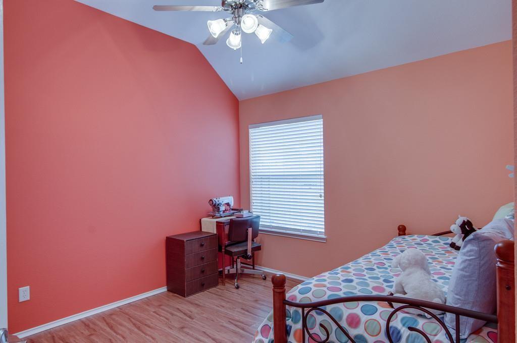 13049 Fencerow Road Fort Worth, TX 76244 - Photo 20 of 32 a bedroom with a bed and a window