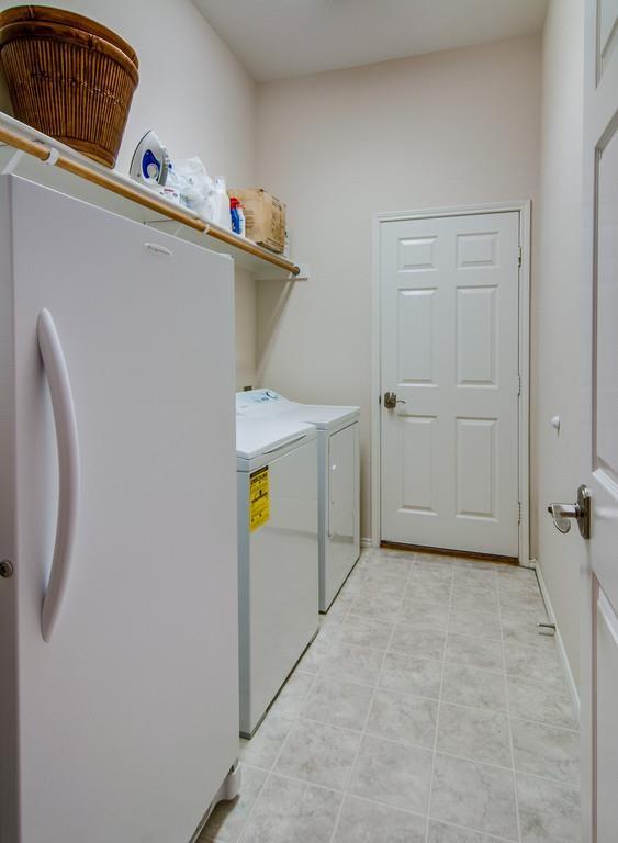13049 Fencerow Road Fort Worth, TX 76244 - Photo 22 of 32 a utility room with dryer and washer