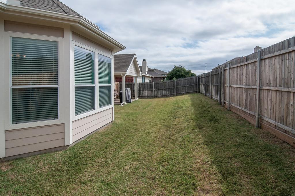 13049 Fencerow Road Fort Worth, TX 76244 - Photo 24 of 32 a view of a backyard