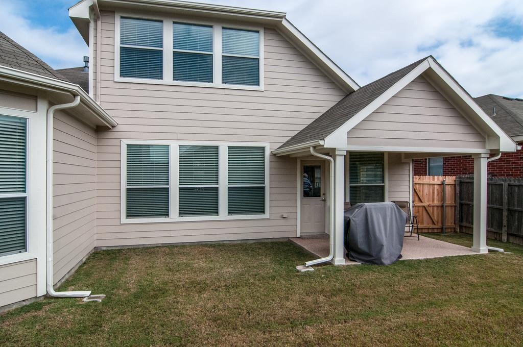 13049 Fencerow Road Fort Worth, TX 76244 - Photo 25 of 32 a view of a house with a yard