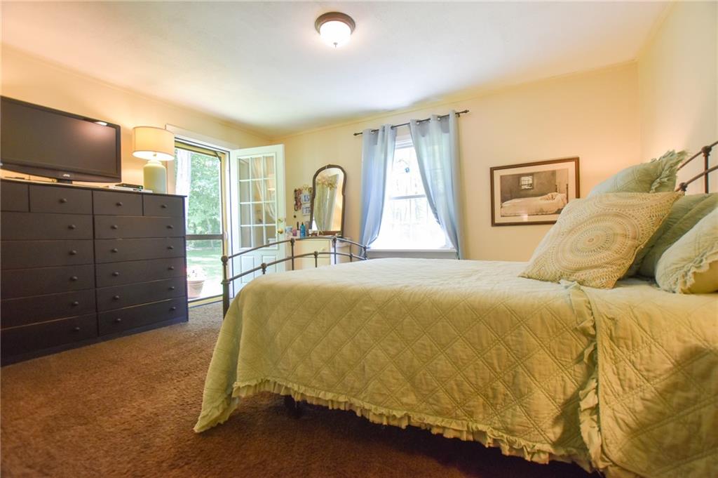 322 Marwood Road Cabot, PA 16023 - Photo 8 of 16 a bedroom with a bed and flat screen tv
