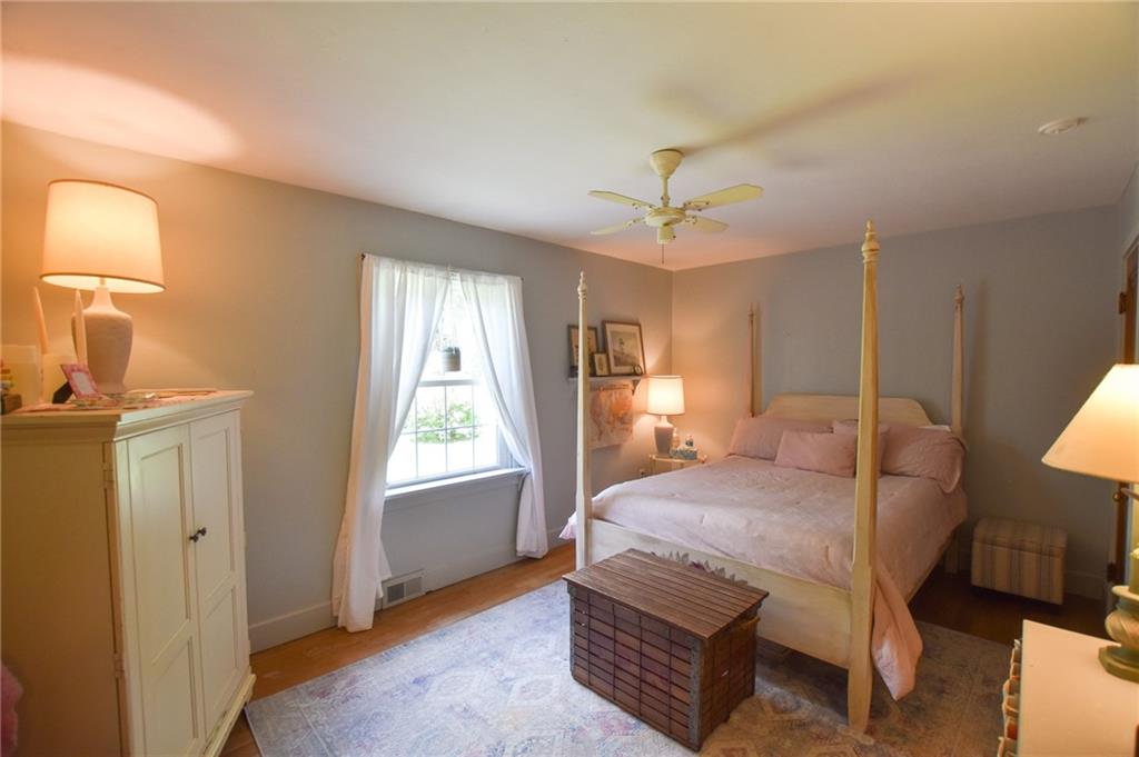 322 Marwood Road Cabot, PA 16023 - Photo 10 of 16 a bedroom with a bed chandelier and a window