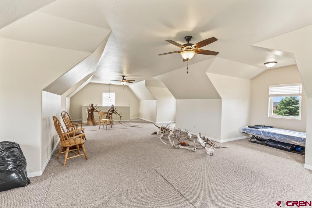 15103 6260th Road Montrose, CO 81403 - Photo 41 of 45 a room with gym equipment and a chandelier