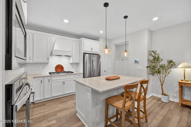 a bathroom with a sink mirror and toilet