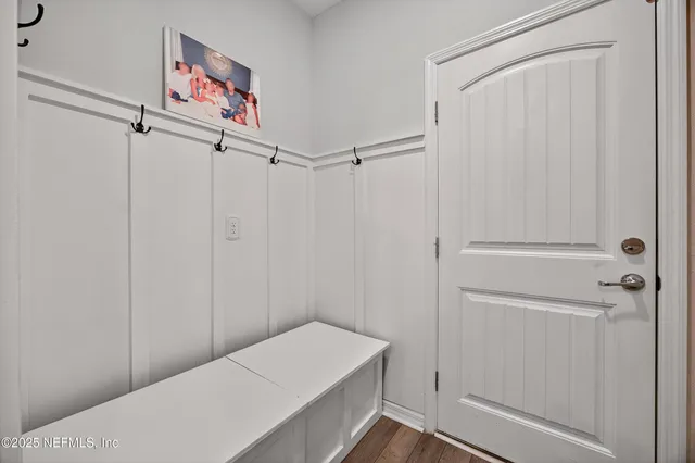 a living room with furniture and closet