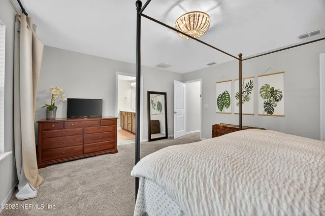 a bathroom with a double vanity sink mirror and shower