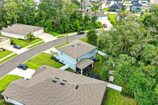 a picture of a work space with furniture and a book shelf