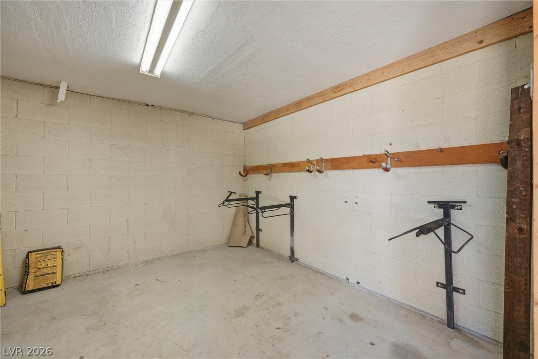 1531 West Harris Farm Road Pahrump, NV 89060 - Photo 12 of 37 Secure storage space for equestrian gear, complete with wall-mounted hooks and saddle racks.