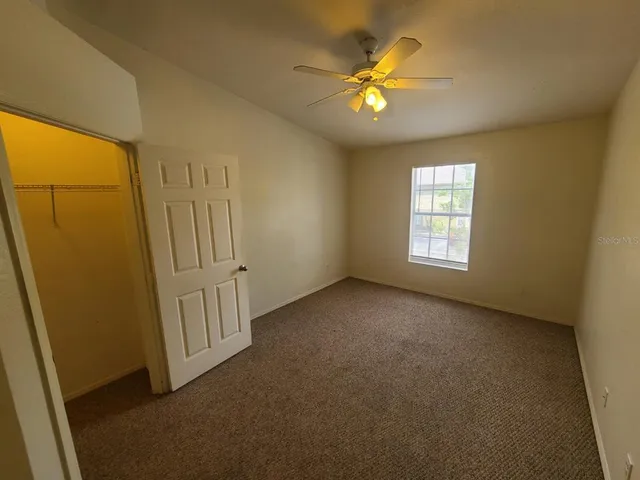 an empty room with a bathroom
