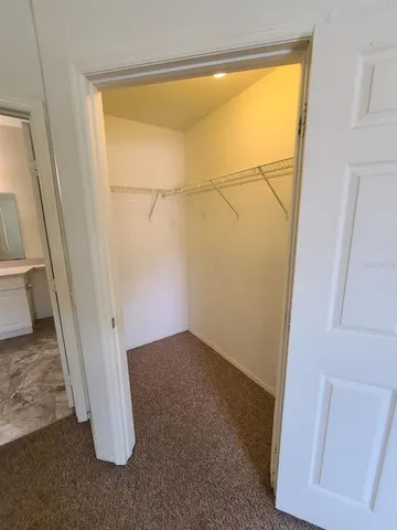 a bathroom with a sink and mirror with toilet