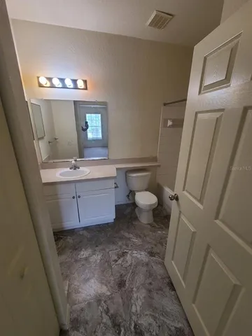 a bathroom with a tub and shower