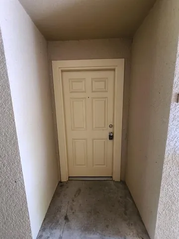 a view of a hallway with an empty room