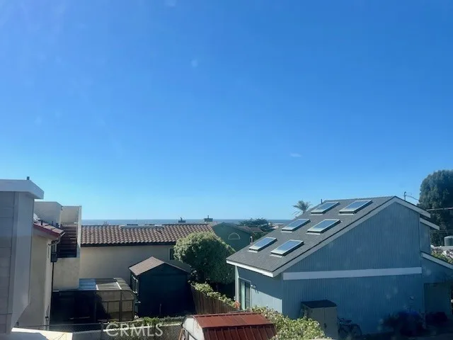 a view of small space with wooden floor and a window