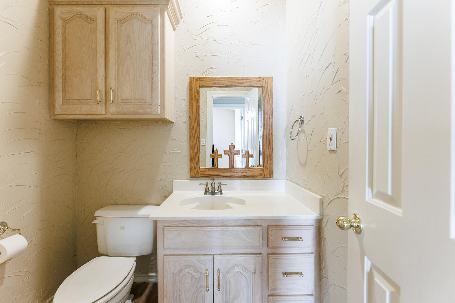 206 Collins Avenue Sundown, TX 79372 - Photo 49 of 82 a bathroom with a sink vanity mirror and toilet