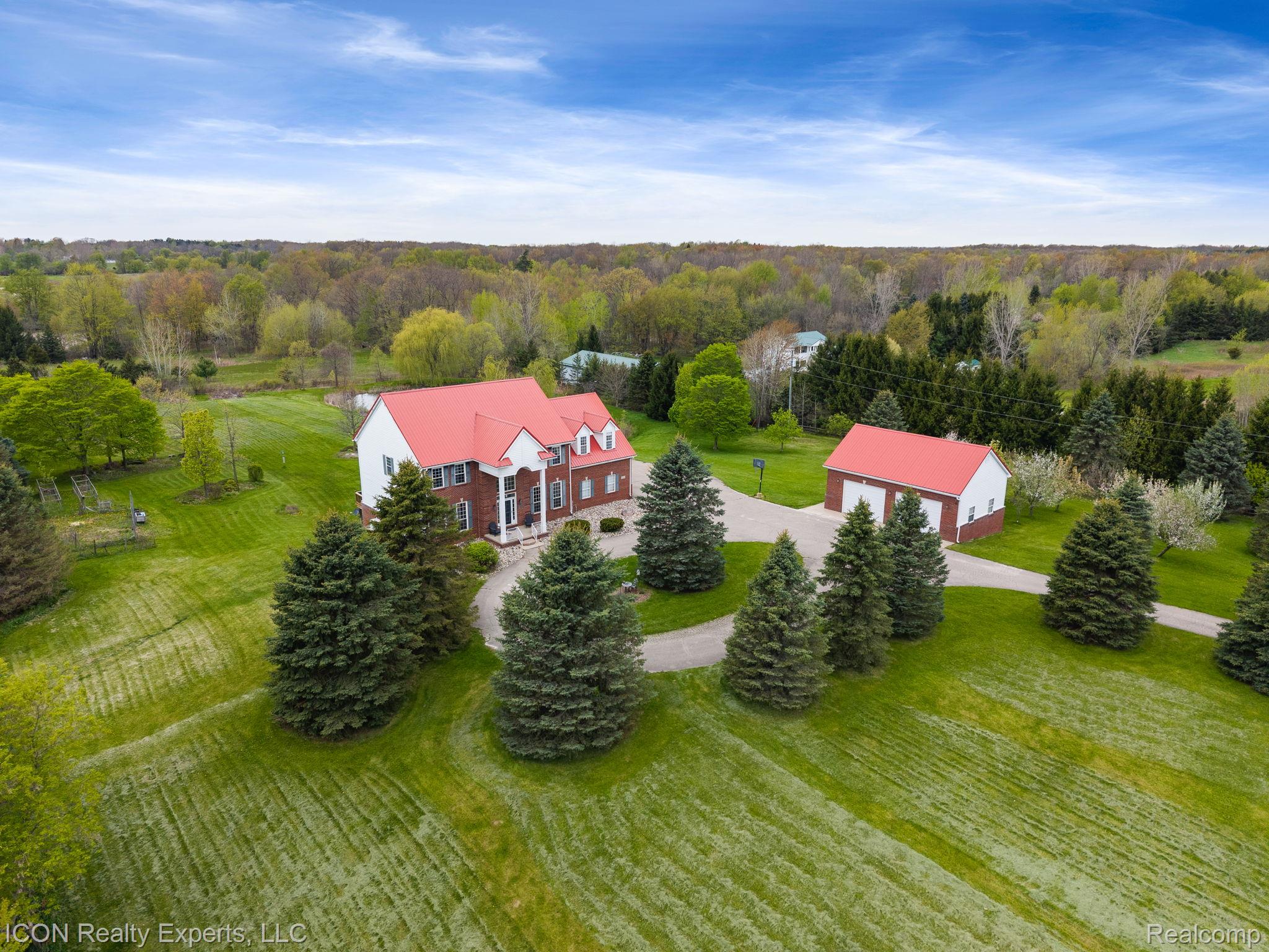 5128 Baldwin Road Metamora, MI 48455 - Photo 61 of 68 View from above of property with a heavily wooded area