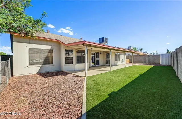 a view of house with yard and entertaining space