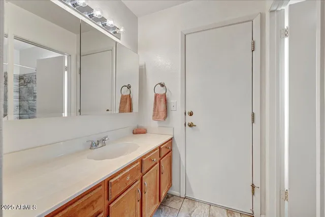 a bathroom with a double vanity sink and mirror