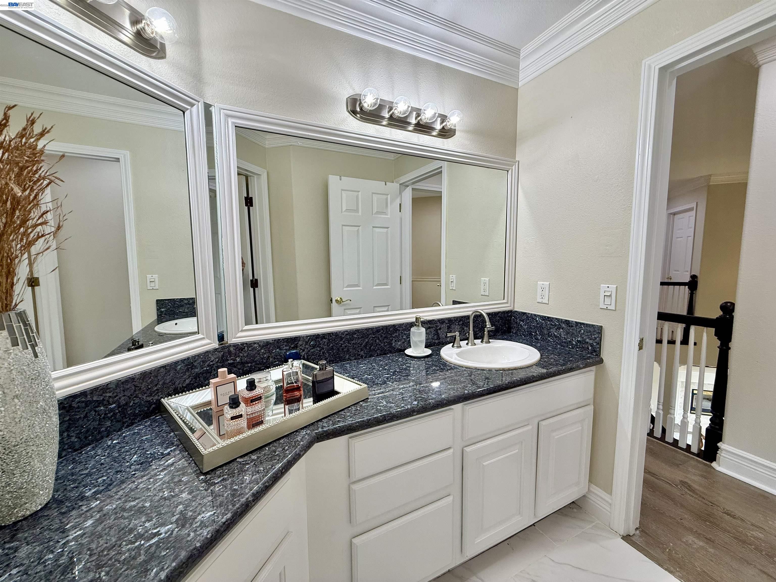 1284 Riesling Circle Livermore, CA 94550 - Photo 61 of 79 a bathroom with a granite countertop sink and a mirror