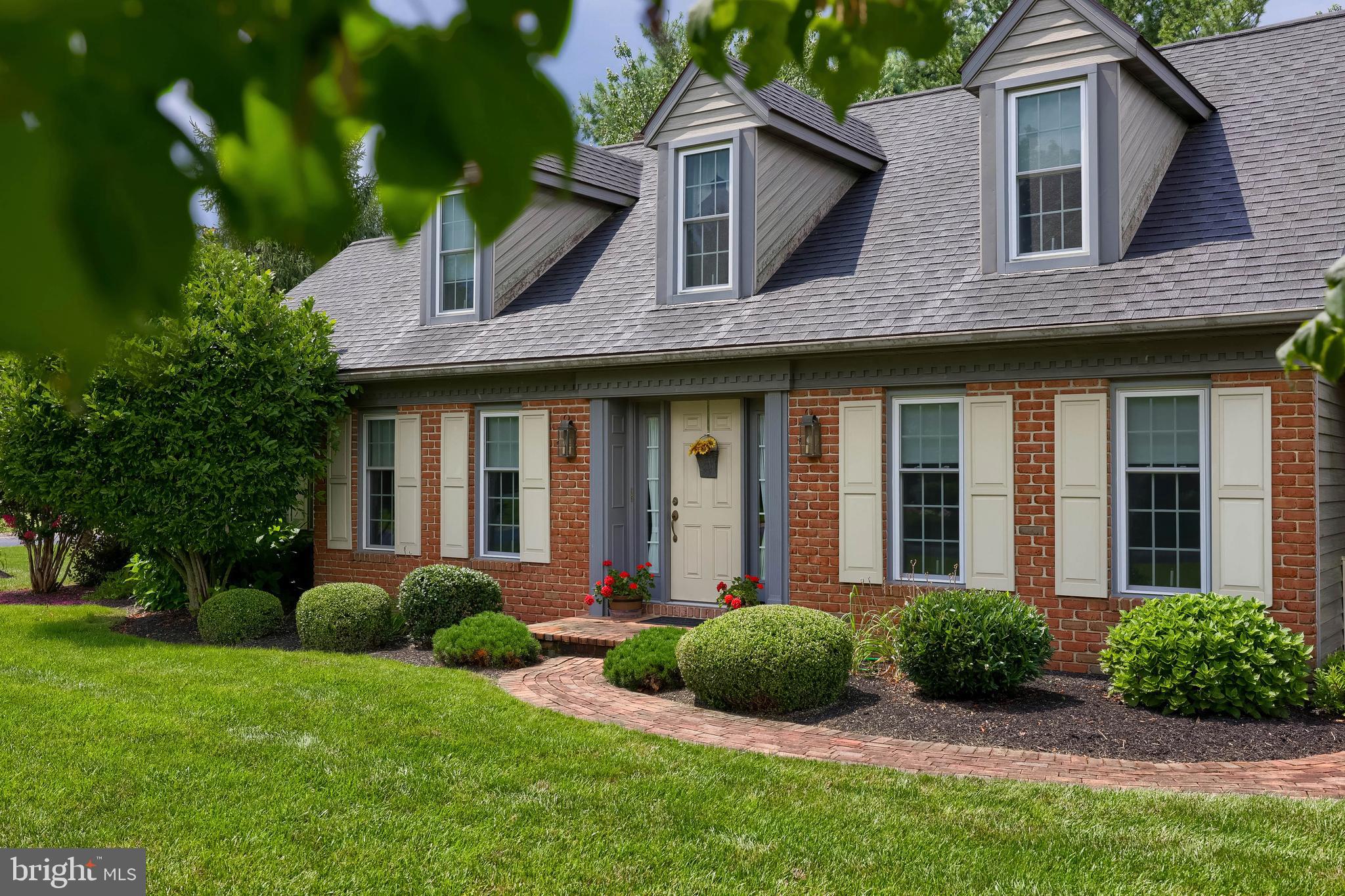 100 Olde Field Drive Lititz, PA 17543 - Photo 3 of 63 a view of a brick house with a yard plants and large tree