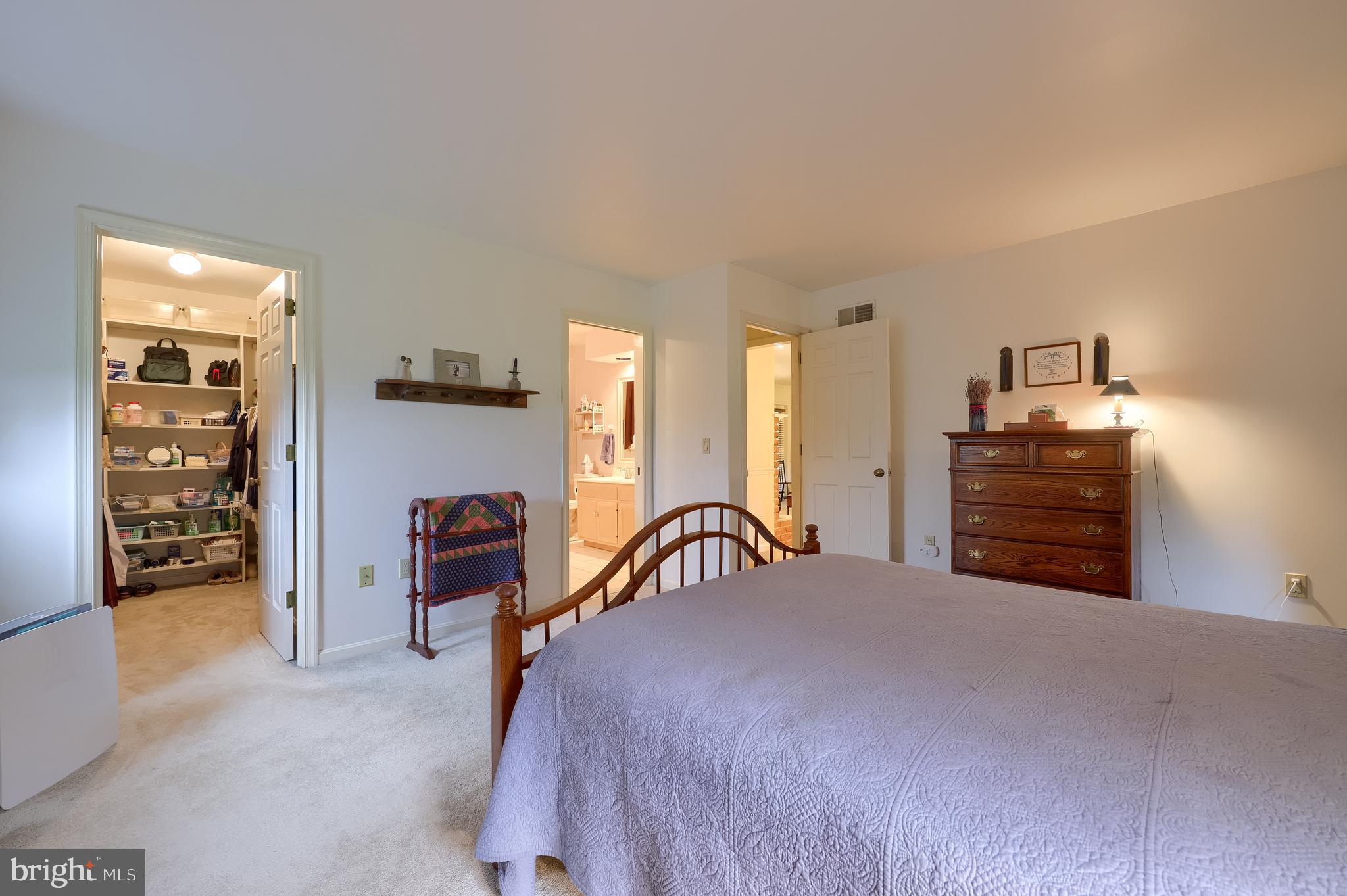 100 Olde Field Drive Lititz, PA 17543 - Photo 42 of 63 a bedroom with a bed and dresser with mirror
