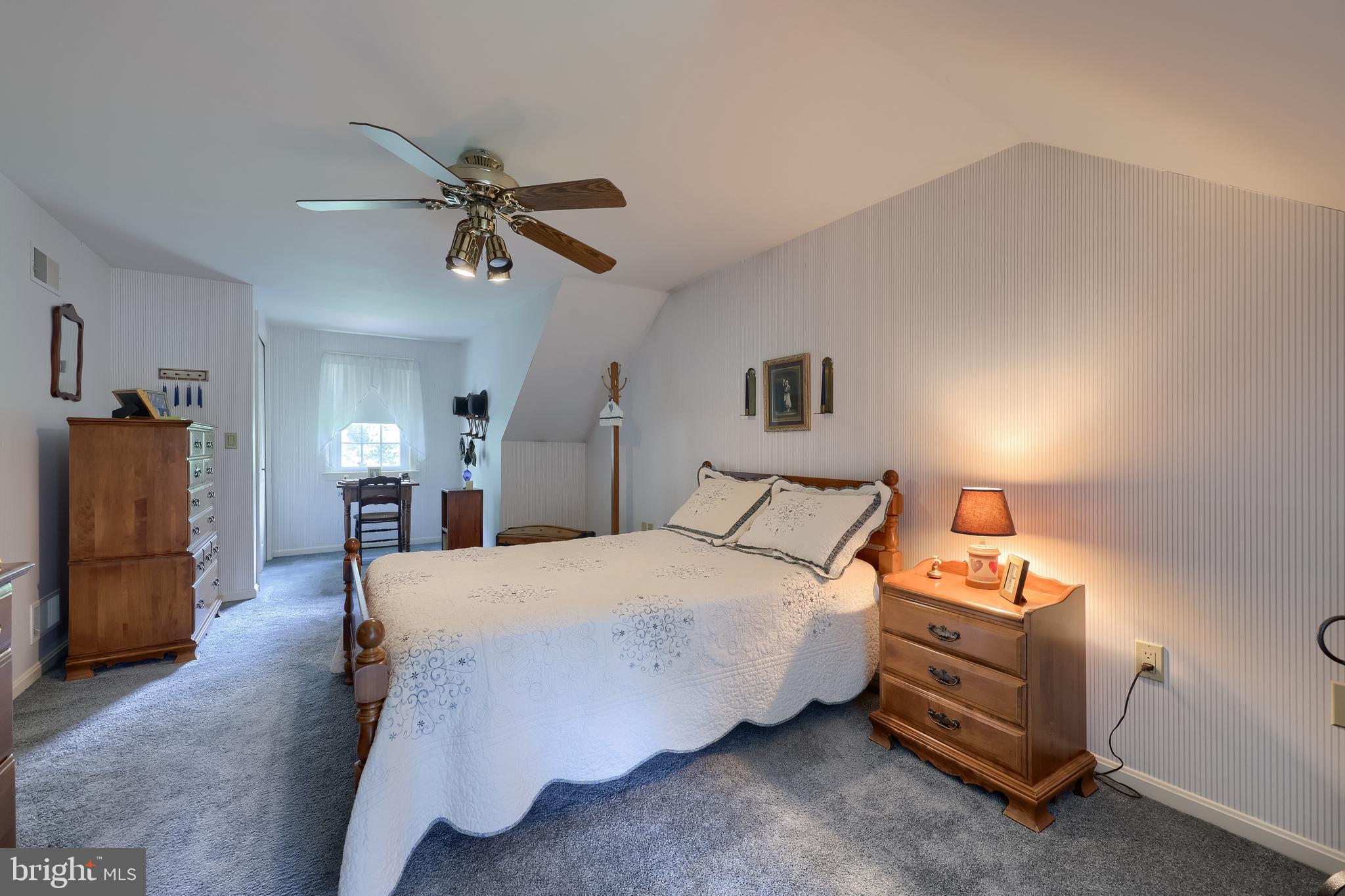 100 Olde Field Drive Lititz, PA 17543 - Photo 50 of 63 a bedroom with a bed and a chandelier