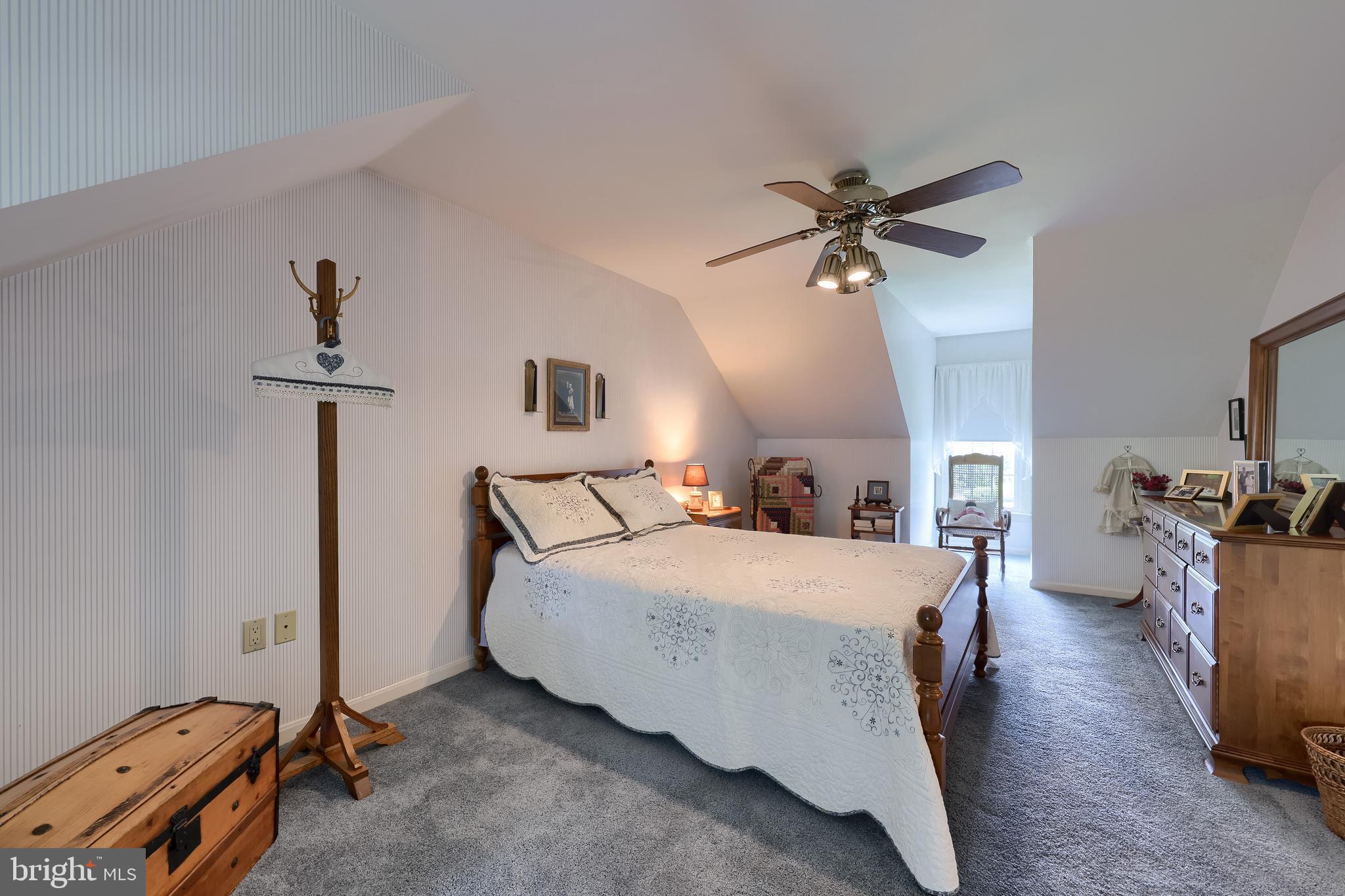 100 Olde Field Drive Lititz, PA 17543 - Photo 51 of 63 a bedroom with a bed and a chandelier