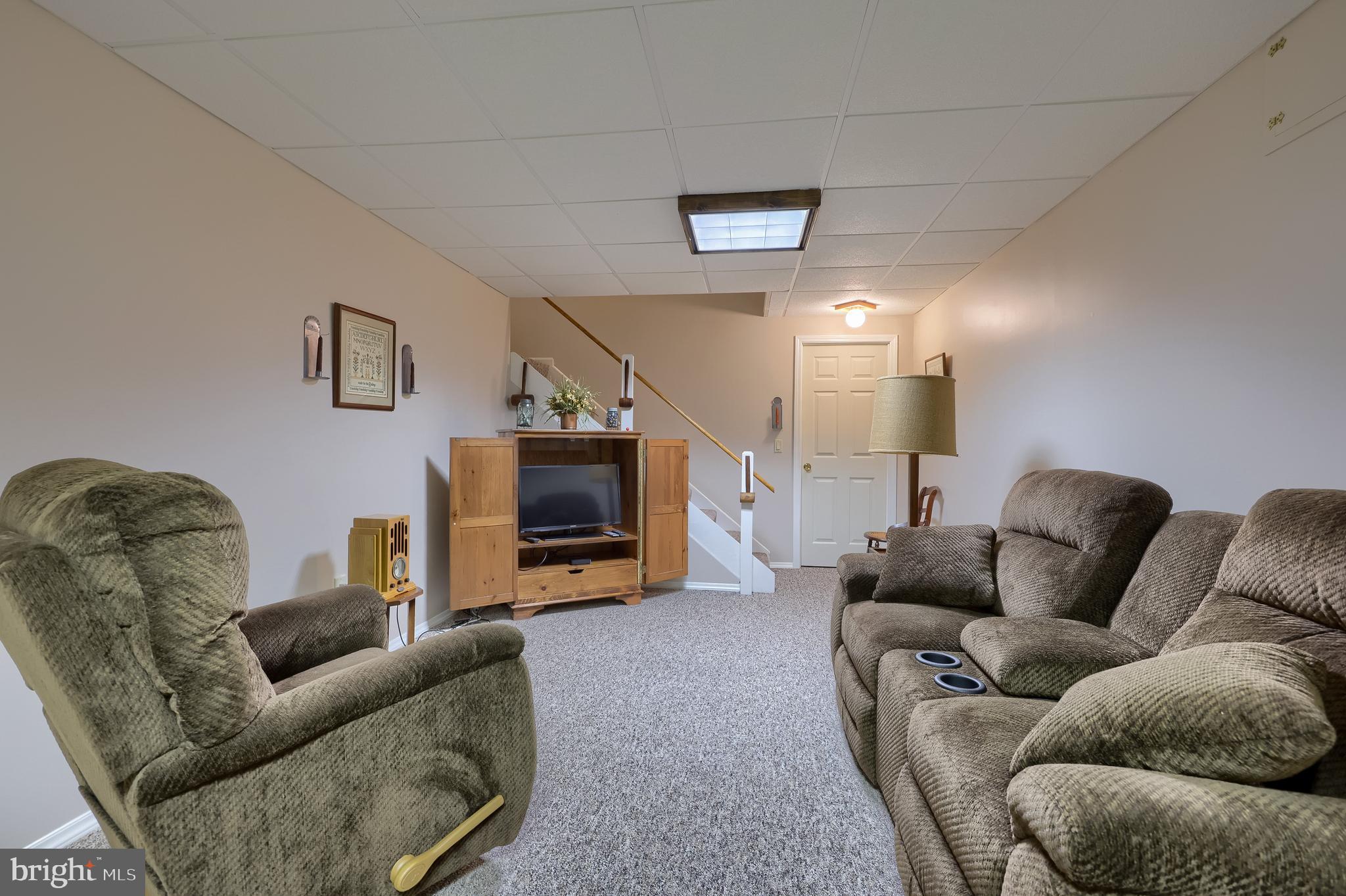 100 Olde Field Drive Lititz, PA 17543 - Photo 58 of 63 a living room with furniture and a flat screen tv