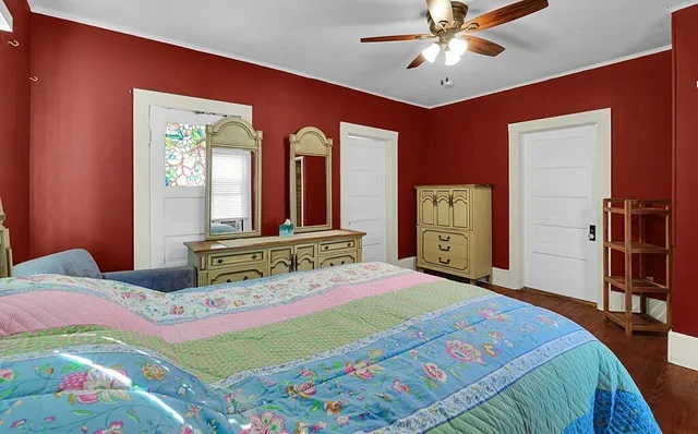 a bedroom with a bed and a dresser