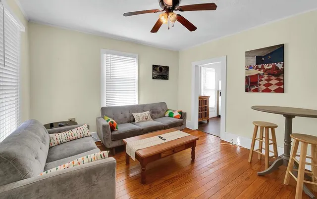 a living room with furniture and a window