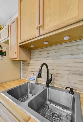 a kitchen with a sink and cabinets