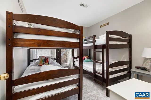 a bathroom with a sink mirror vanity and toilet