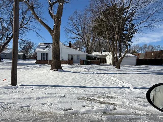 a view of a yard with a tree