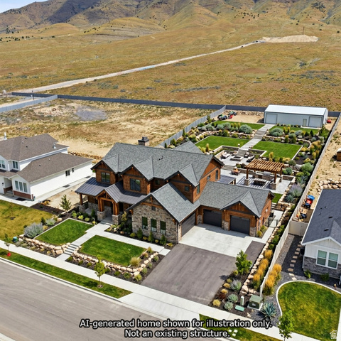 2930 Jojo Road, Unit 110 Eagle Mountain, UT 84005 - Photo 2 of 22 Aerial view of residential area featuring a mountain backdrop with AI built custom home.